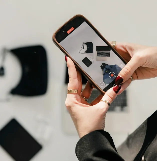 Filming a flat lay of clothes and accessories on a phone