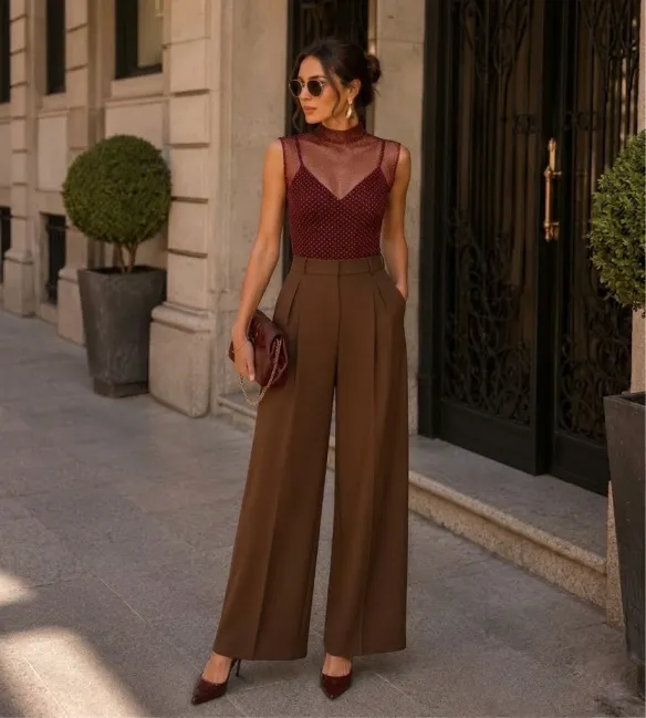 A burgundy top with brown wide-leg trousers